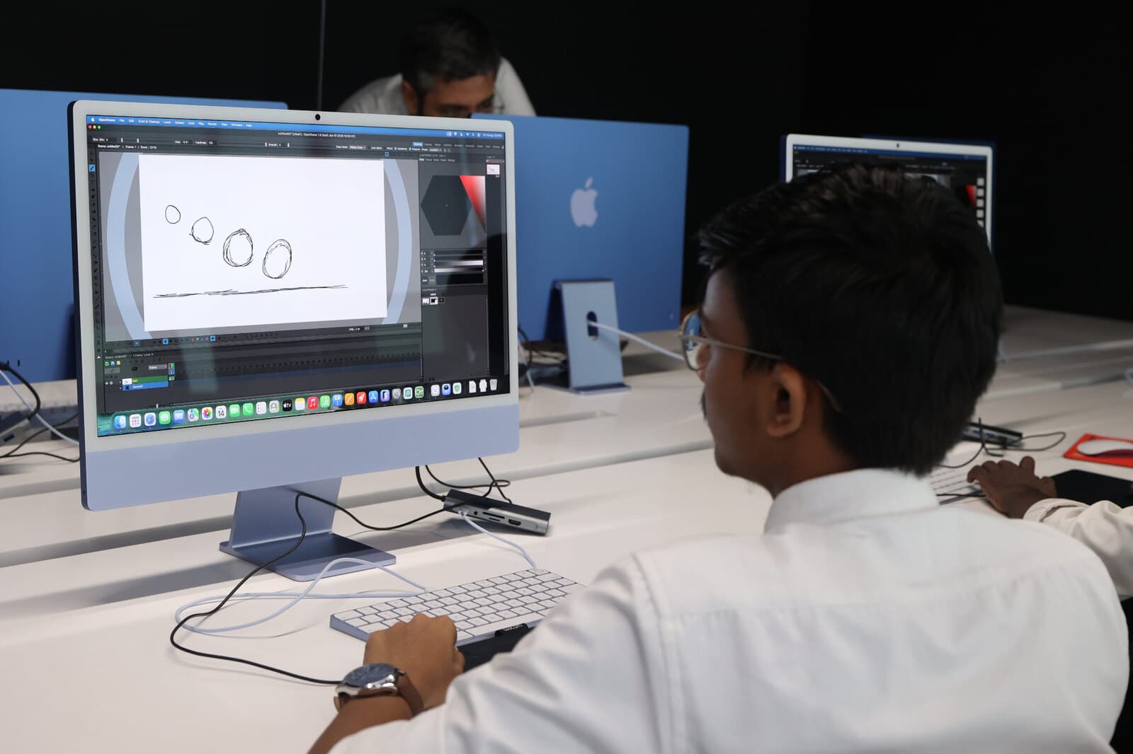 A student working on digital design in a technology learning space